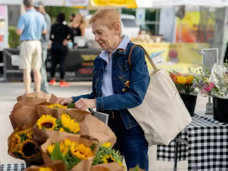 a woman shops for flowers